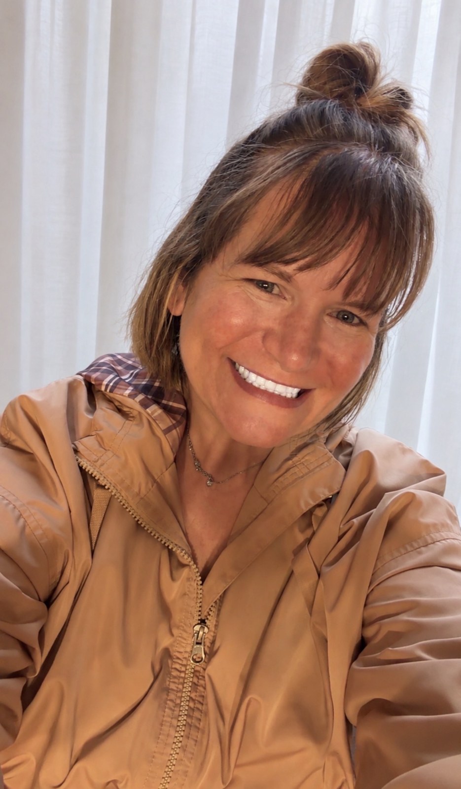 Tina smiling, the creator of Anxious But Growing